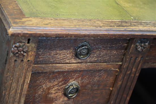 A late Victorian oak desk by Gillow, 3ft x 2ft 6in.